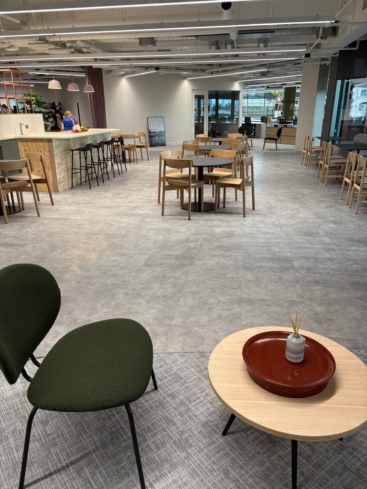 A modern workplace fitted with reused furniture and flooring