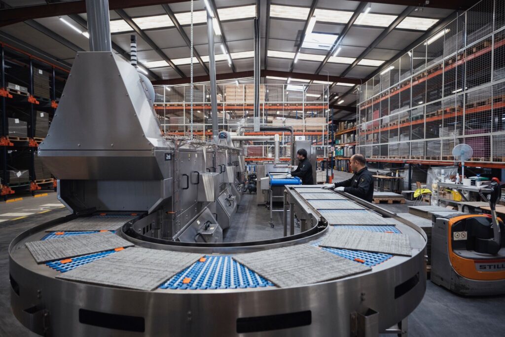 The Watertunnel machine cleaning carpet tiles in the Paris facility