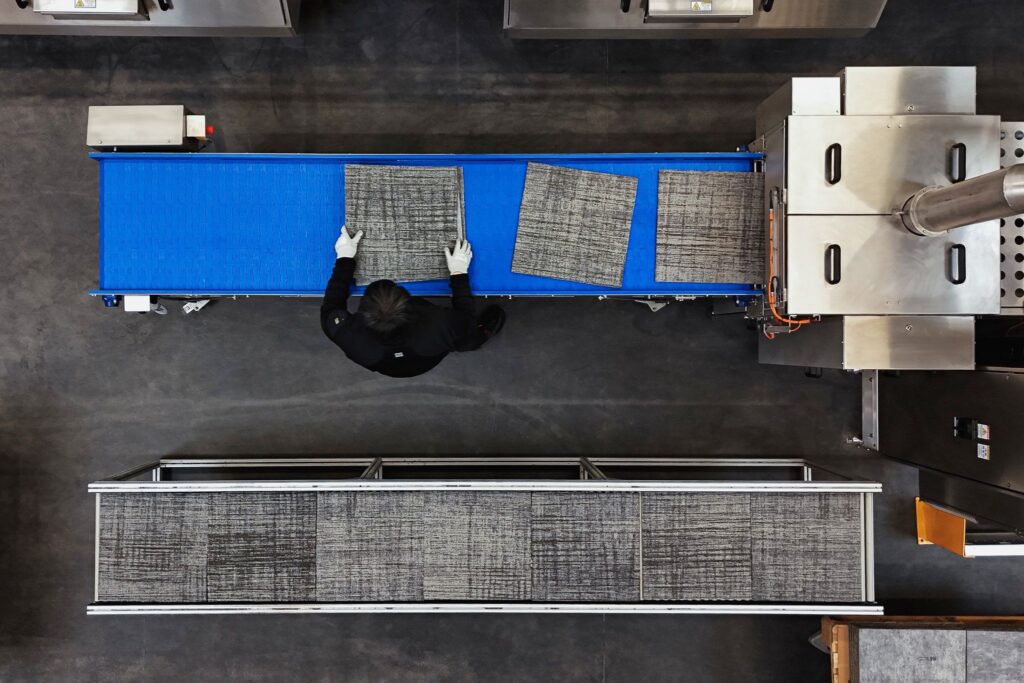 Carpet tiles being inspected on the Watertunnel production line
